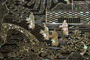 Japanese raden mother-of-pearl inlay depicting figures in a landscape